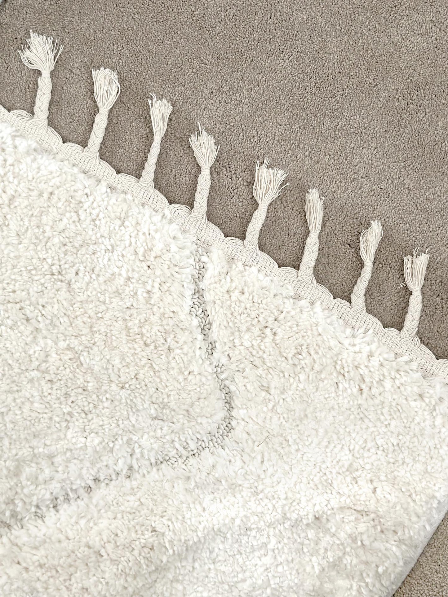 Calypso Ivory Cream Textured Tribal Tassel Rug