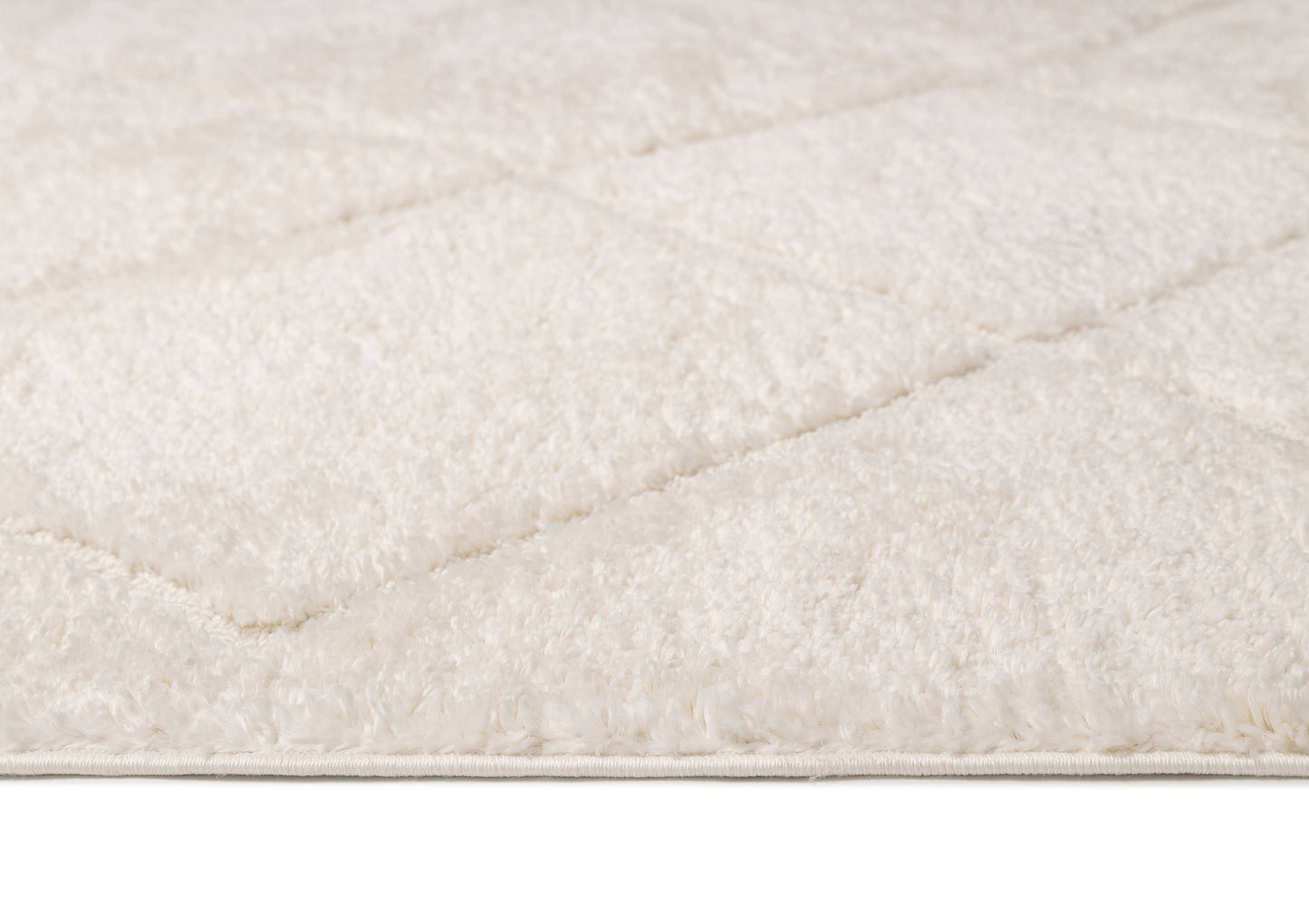 Calypso Ivory Cream Textured Tribal Tassel Rug