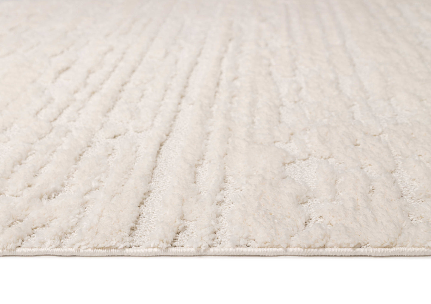 Serena Ivory Cream Textured Tassel Rug